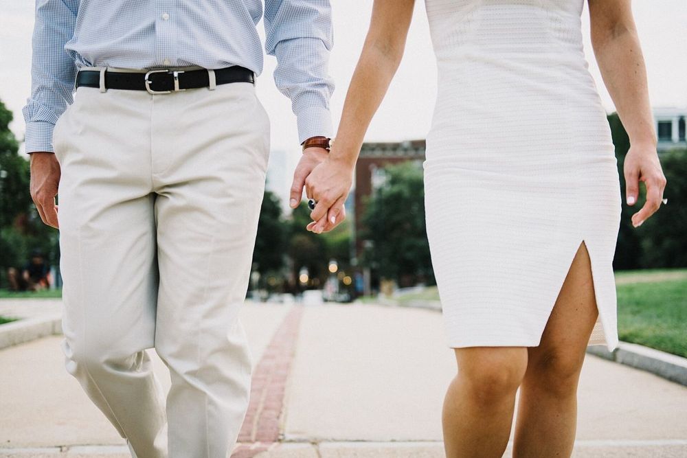 A couple walking hand in hand