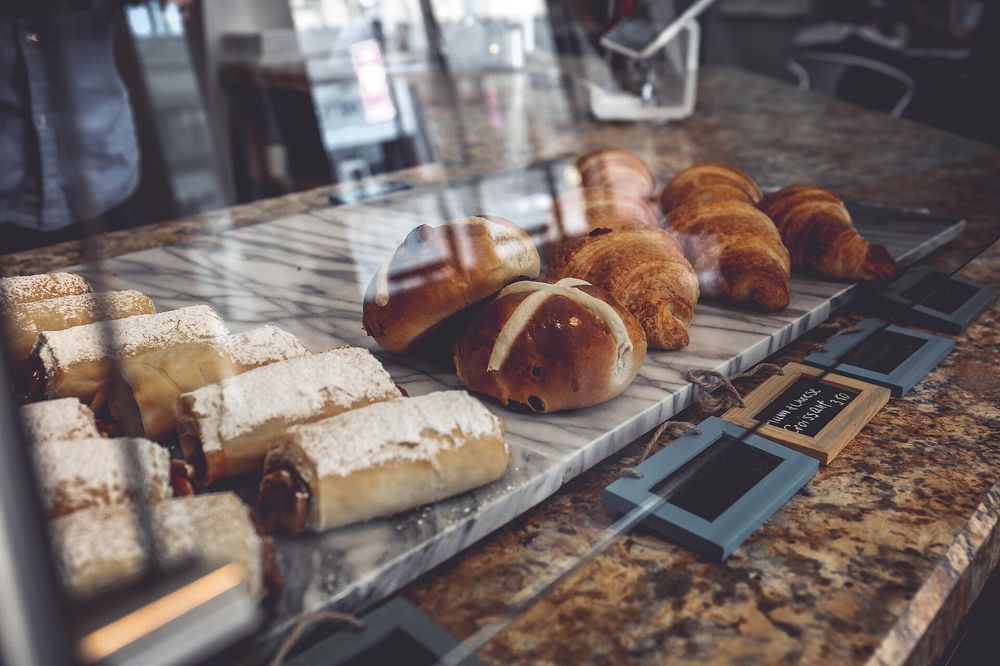 A bakery display case with pastries